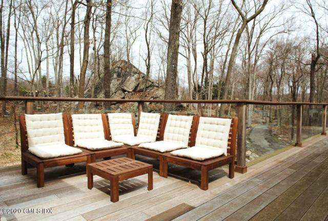 424 Cognewaugh Road Cos Cob, CT 06807 - Photo 25 of 27 a sitting area with wooden benches and sitting