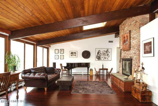 424 Cognewaugh Road Cos Cob, CT 06807 - Photo 5 of 27 a living room with furniture wooden floor and window