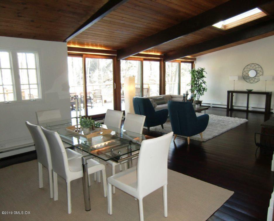 424 Cognewaugh Road Cos Cob, CT 06807 - Photo 6 of 27 a view of a dining room with furniture window and outside view