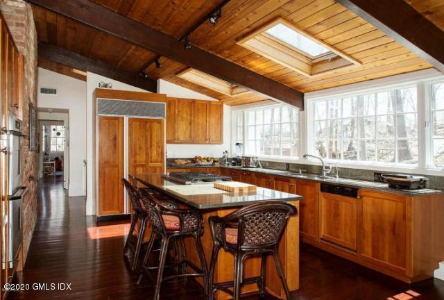 424 Cognewaugh Road Cos Cob, CT 06807 - Photo 7 of 27 a dining table with chairs and window