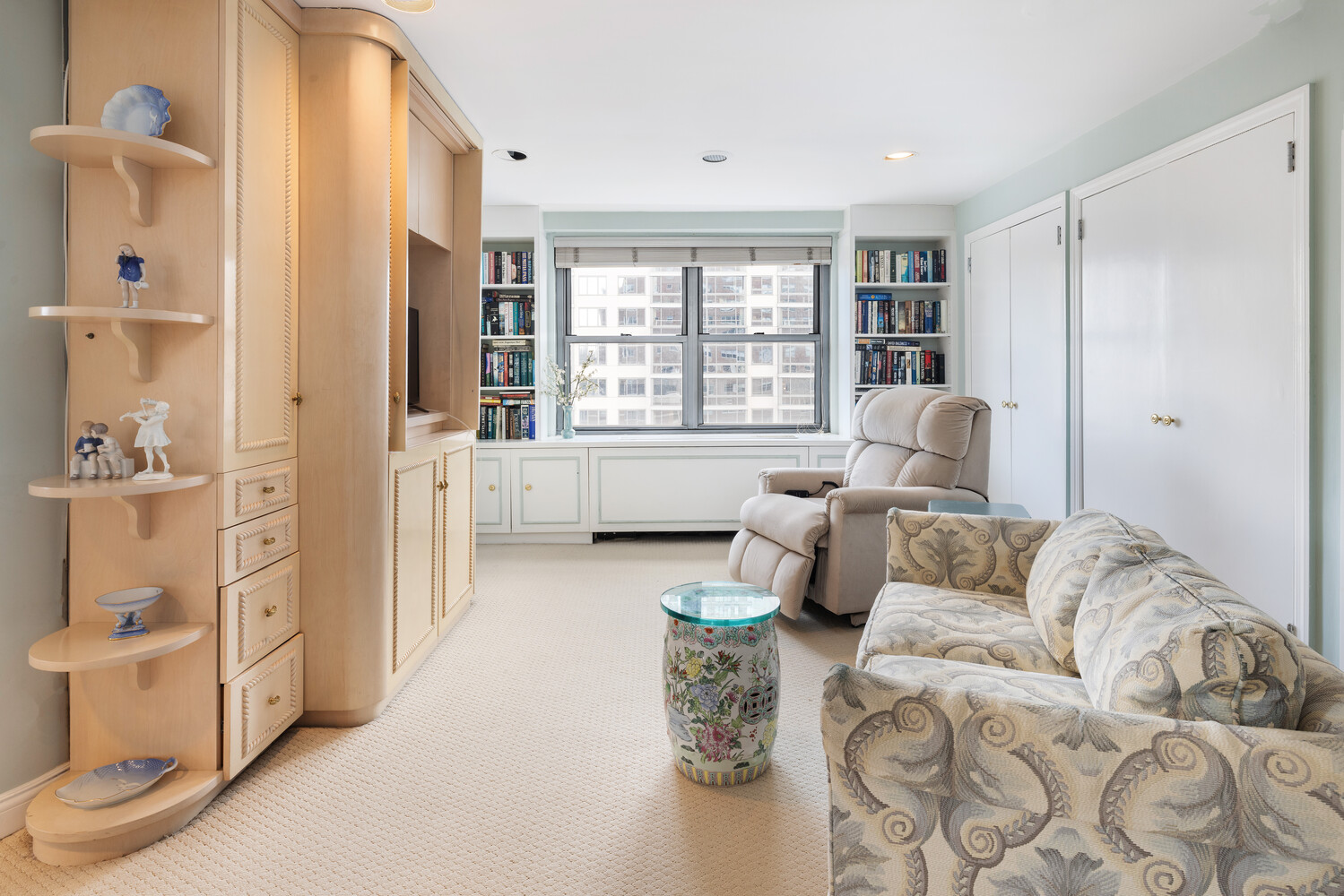 360 East 72nd Street, Unit C1803 Manhattan, NY 10021 - Photo 11 of 15 a living room with furniture and a large window