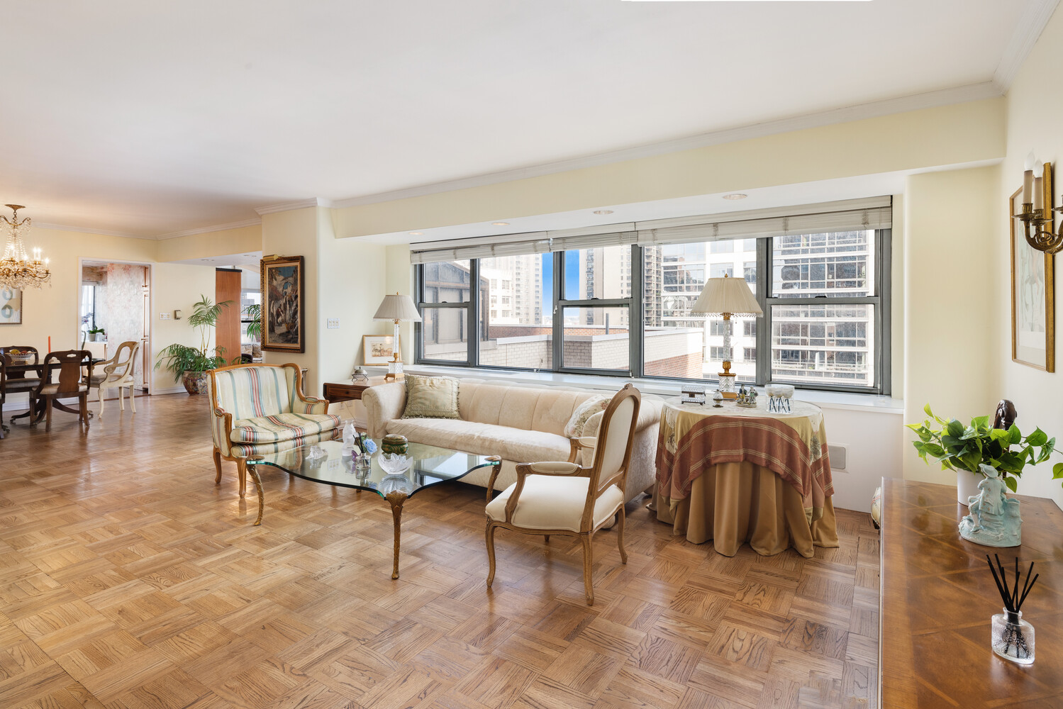 360 East 72nd Street, Unit C1803 Manhattan, NY 10021 - Photo 2 of 15 a living room with furniture and a large window