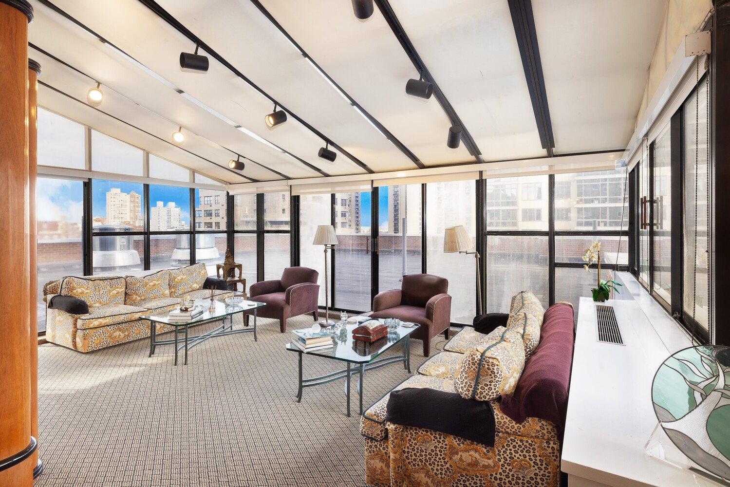 360 East 72nd Street, Unit C1803 Manhattan, NY 10021 - Photo 6 of 15 a living room with furniture and floor to ceiling windows