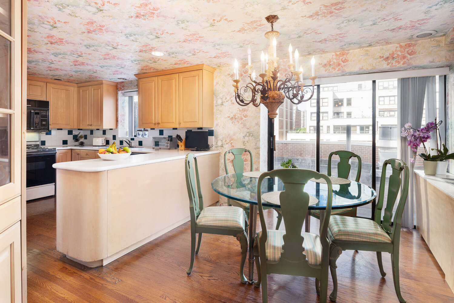 360 East 72nd Street, Unit C1803 Manhattan, NY 10021 - Photo 8 of 15 a dining room with furniture a chandelier and wooden floor