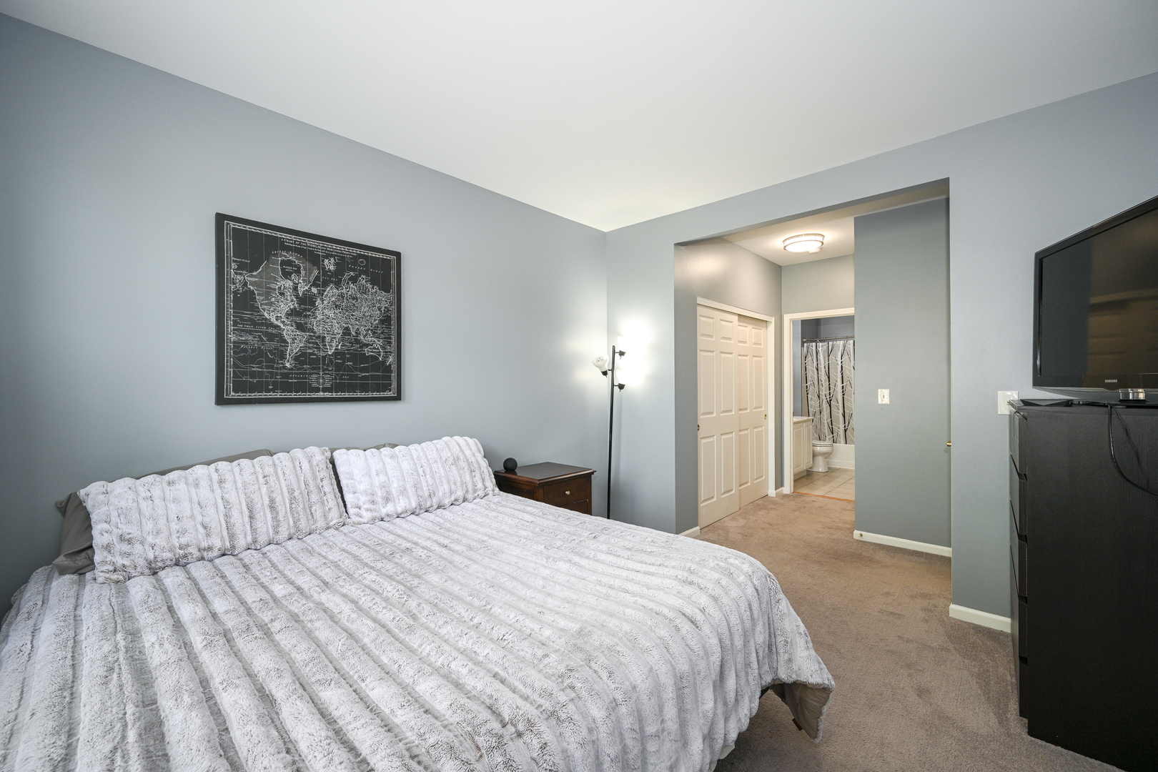 2333 Overlook Court, Unit 2333 Naperville, IL 60563 - Photo 12 of 24 a bedroom with a bed and a flat screen tv