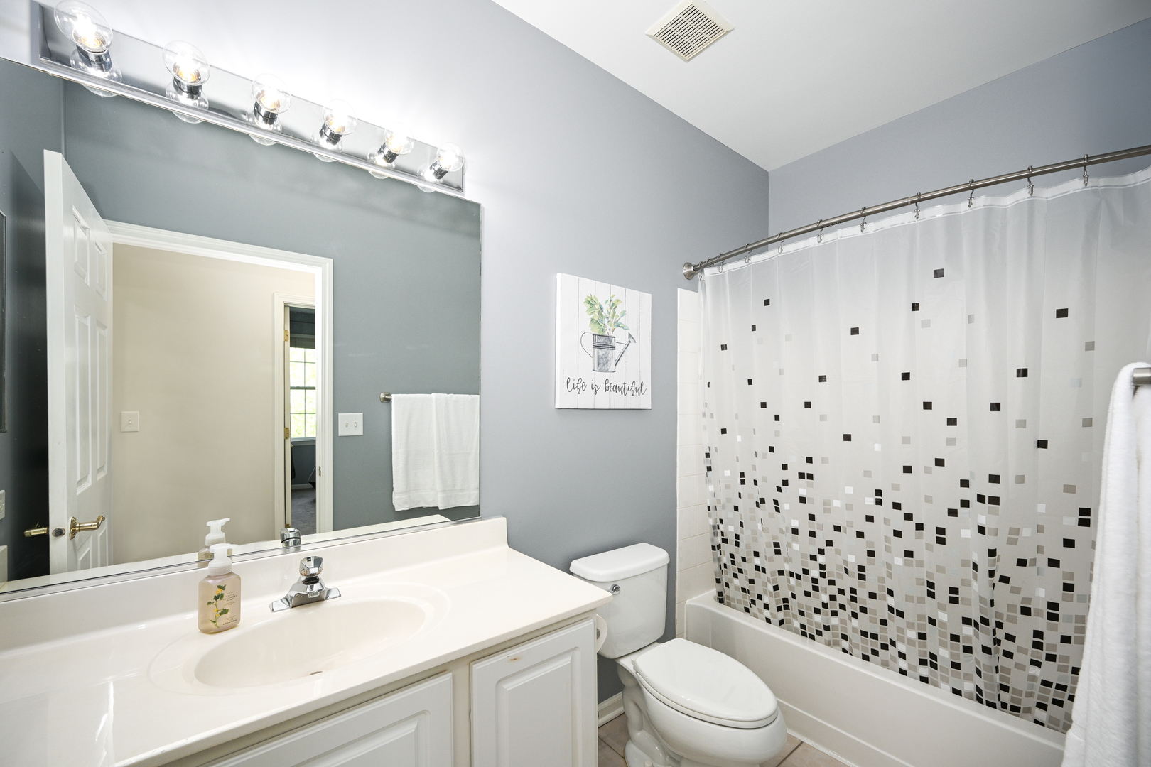 2333 Overlook Court, Unit 2333 Naperville, IL 60563 - Photo 15 of 24 a bathroom with a sink a toilet a shower and a mirror