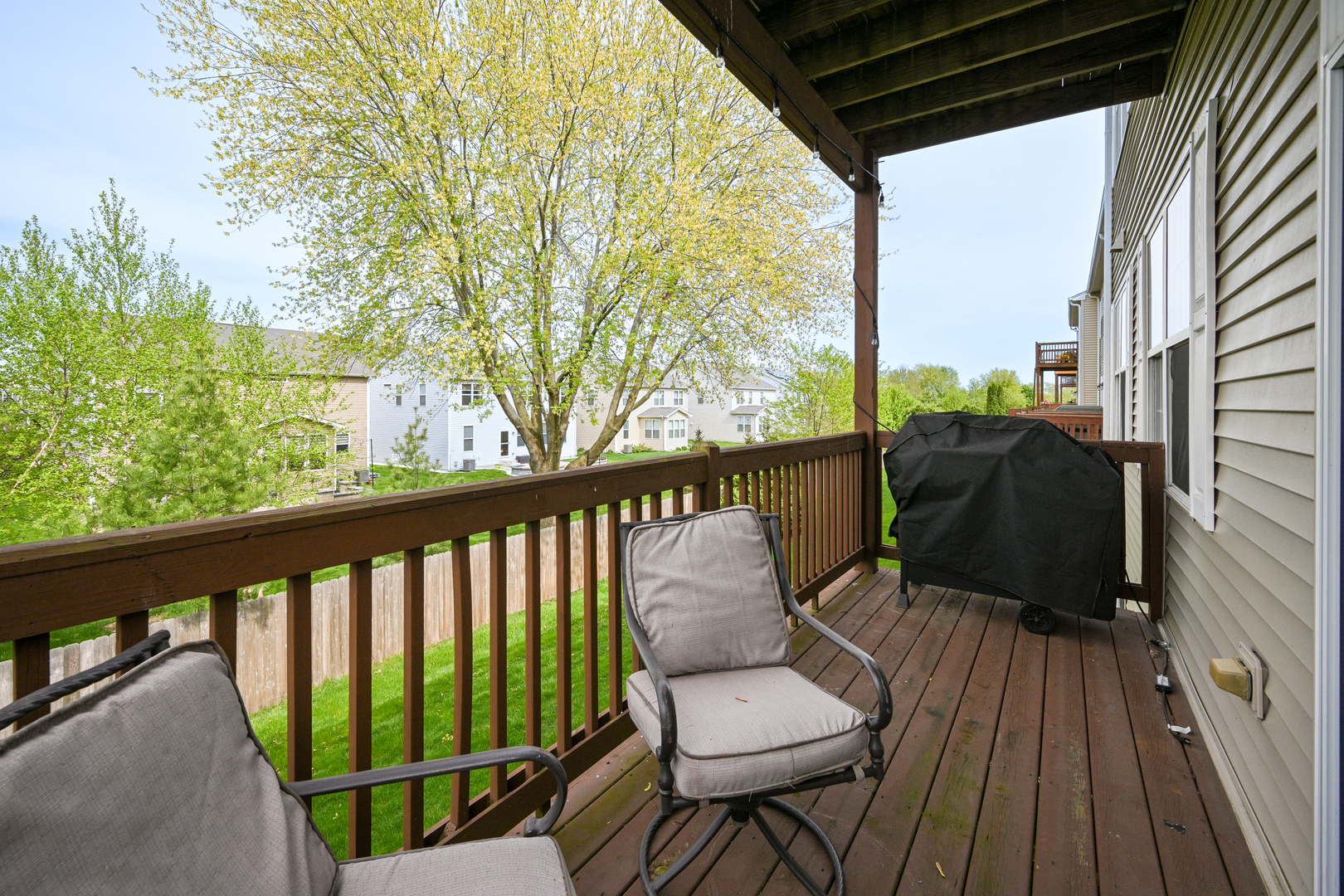 2333 Overlook Court, Unit 2333 Naperville, IL 60563 - Photo 23 of 24 a view of balcony with wooden floor and outdoor seating