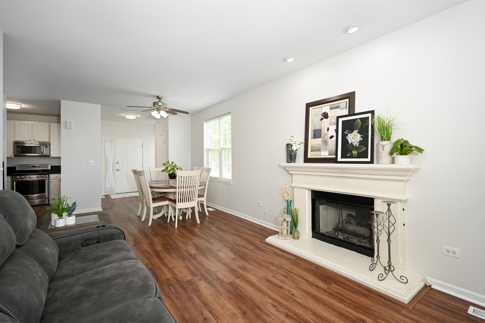 2333 Overlook Court, Unit 2333 Naperville, IL 60563 - Photo 6 of 24 a living room with furniture a fireplace and a table