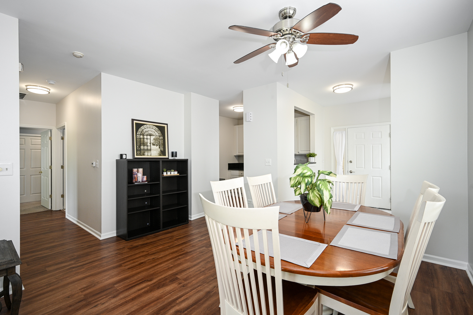 2333 Overlook Court, Unit 2333 Naperville, IL 60563 - Photo 7 of 24 a view of a dining room with furniture and wooden floor
