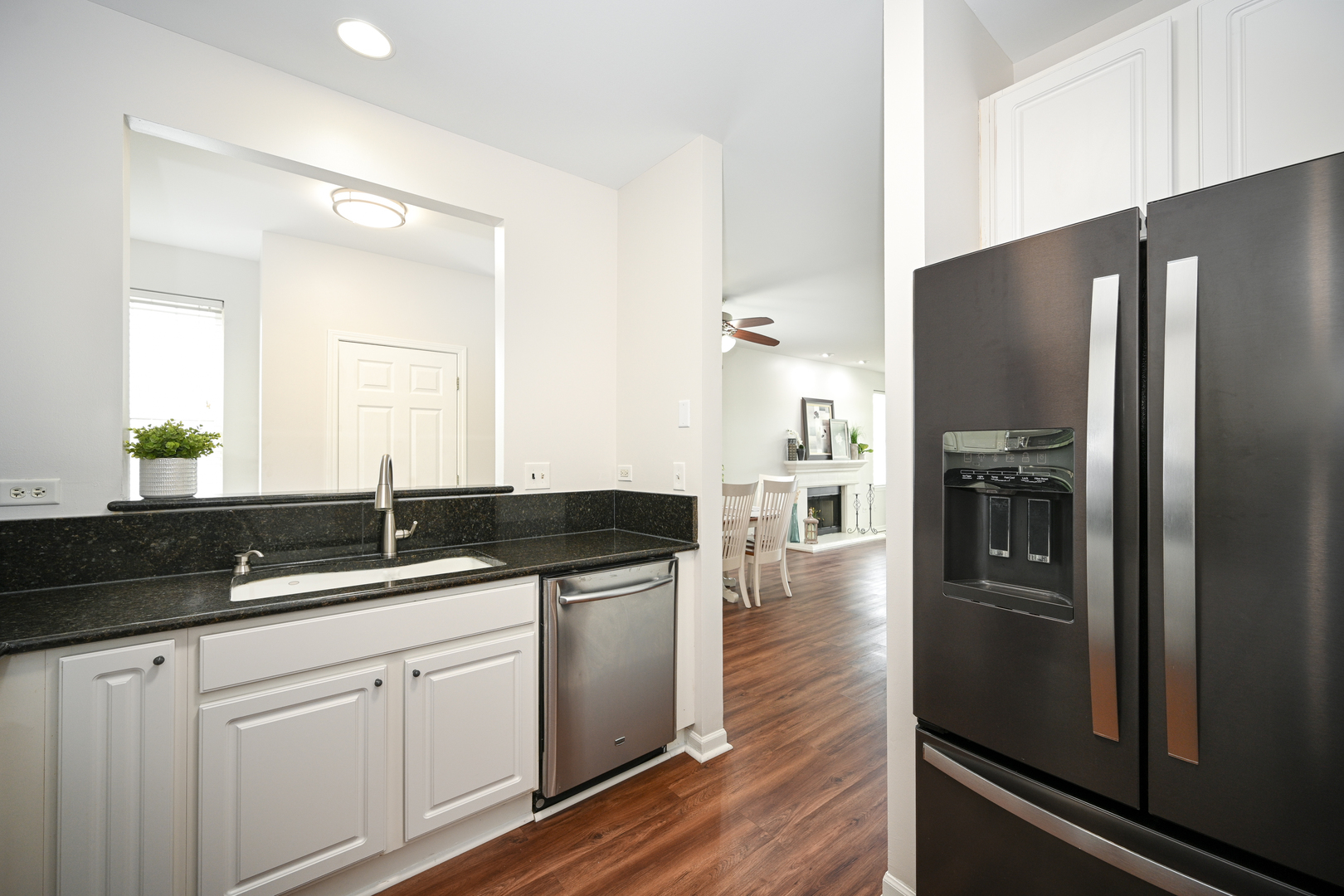 2333 Overlook Court, Unit 2333 Naperville, IL 60563 - Photo 9 of 24 a kitchen with granite countertop a refrigerator and a sink