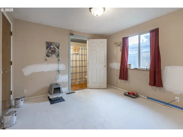 a living room with furniture and large windows