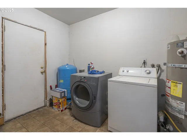 a bathroom with a granite countertop sink mirror vanity and toilet