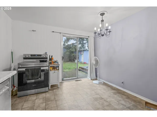 a kitchen with cabinets and window