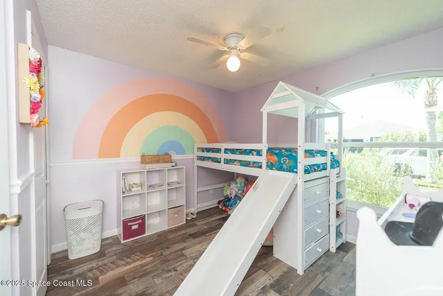 a view of a living room and a floor to ceiling window
