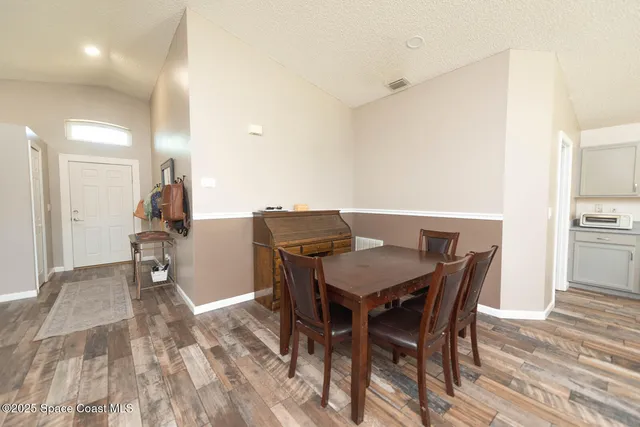 a workspace with furniture and wooden floor