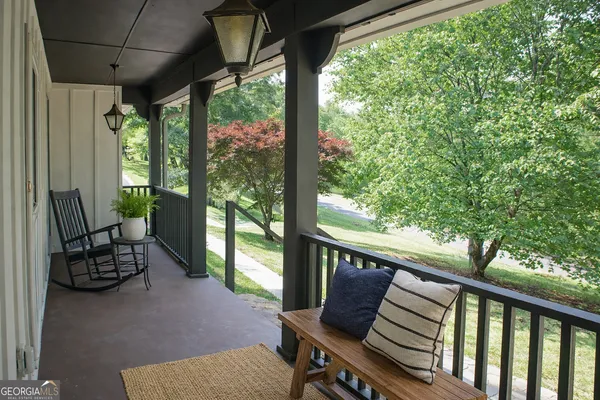 a view of a two chairs in the balcony