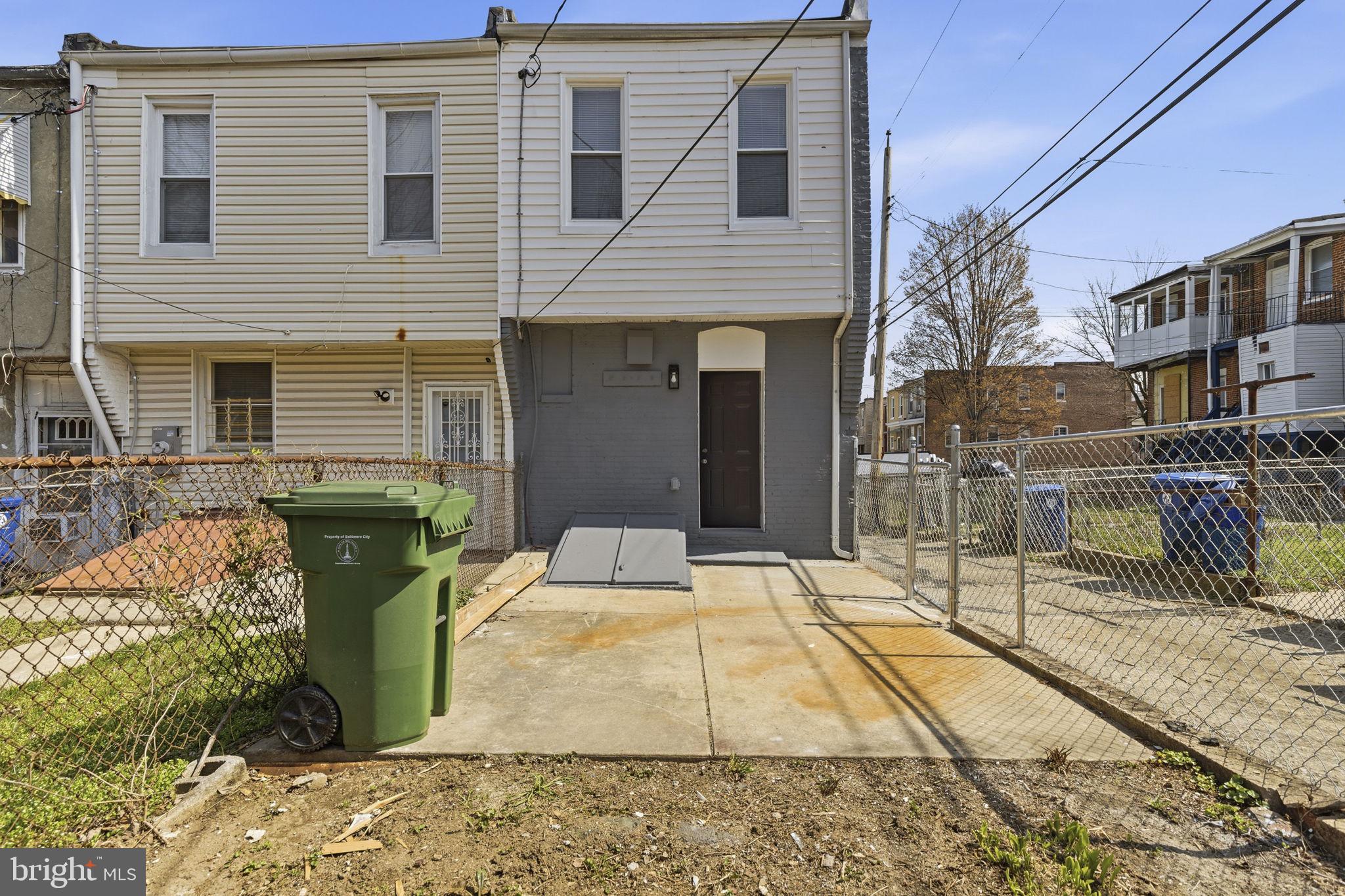 1200 North Dukeland Street Baltimore, MD 21216 - Photo 16 of 17 a view of a patio with couches chairs and wooden floor