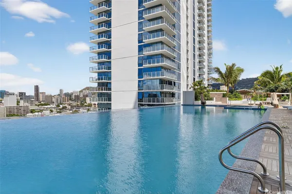 a view of a swimming pool and lounge chair