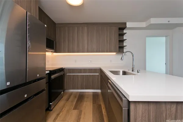 a kitchen with a sink and wooden cabinets