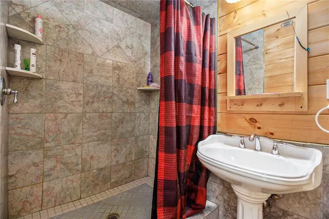 a bedroom with a bed and a table