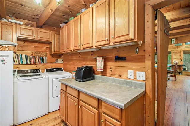 a bathroom with a sink a toilet and shower curtain