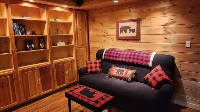 a bed sitting in a bedroom next to a wooden cabinet