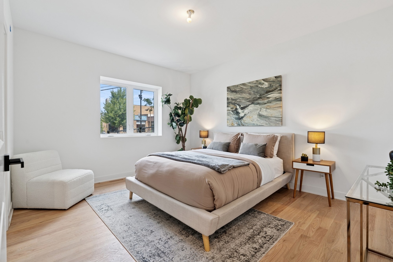 6755 North Hermitage Avenue, Unit 2 Chicago, IL 60626 - Photo 8 of 10 a bedroom with bed and a couch