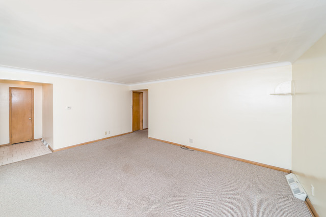 3648 West 81st Street Chicago, IL 60652 - Photo 2 of 17 an empty room with a natural light