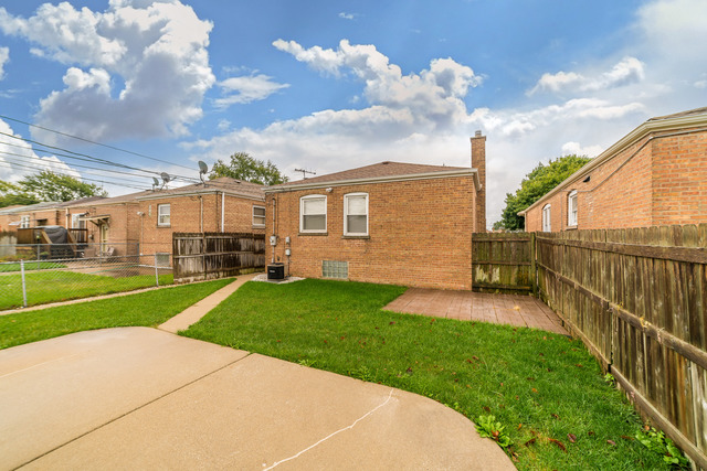 3648 West 81st Street Chicago, IL 60652 - Photo 17 of 17 a view of a porch with a yard
