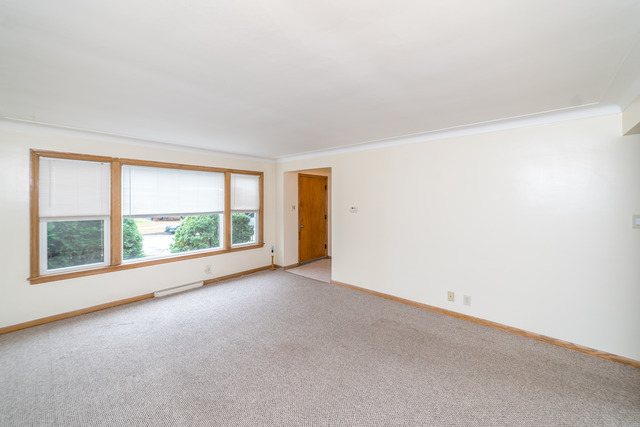 3648 West 81st Street Chicago, IL 60652 - Photo 3 of 17 an empty room with large windows