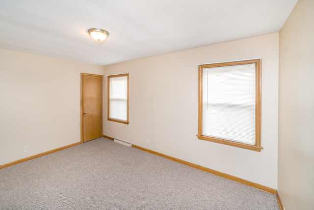 3648 West 81st Street Chicago, IL 60652 - Photo 7 of 17 an empty room with a window