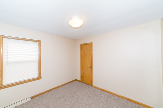 3648 West 81st Street Chicago, IL 60652 - Photo 8 of 17 a view of an empty room with a window