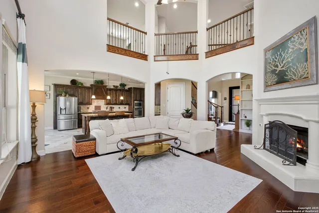 a living room with furniture and a fireplace