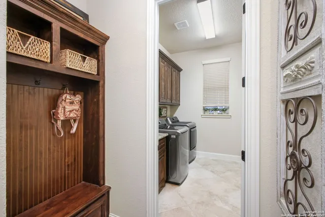 a view of a storage & utility room with a sink