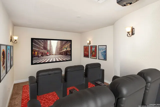 a utility room with granite countertop a sink and a dishwasher