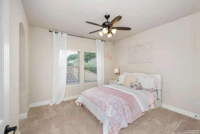 a bathroom with a granite countertop sink a mirror and a bathtub