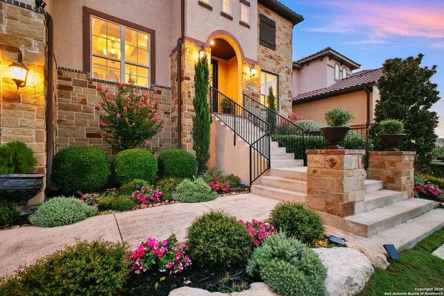 a front view of a multi story residential apartment building with a yard