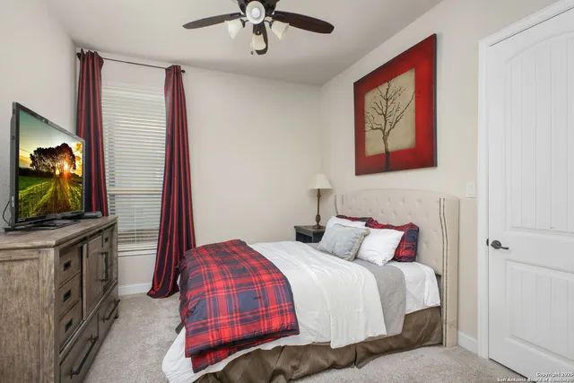 a bathroom with a toilet a sink and shower