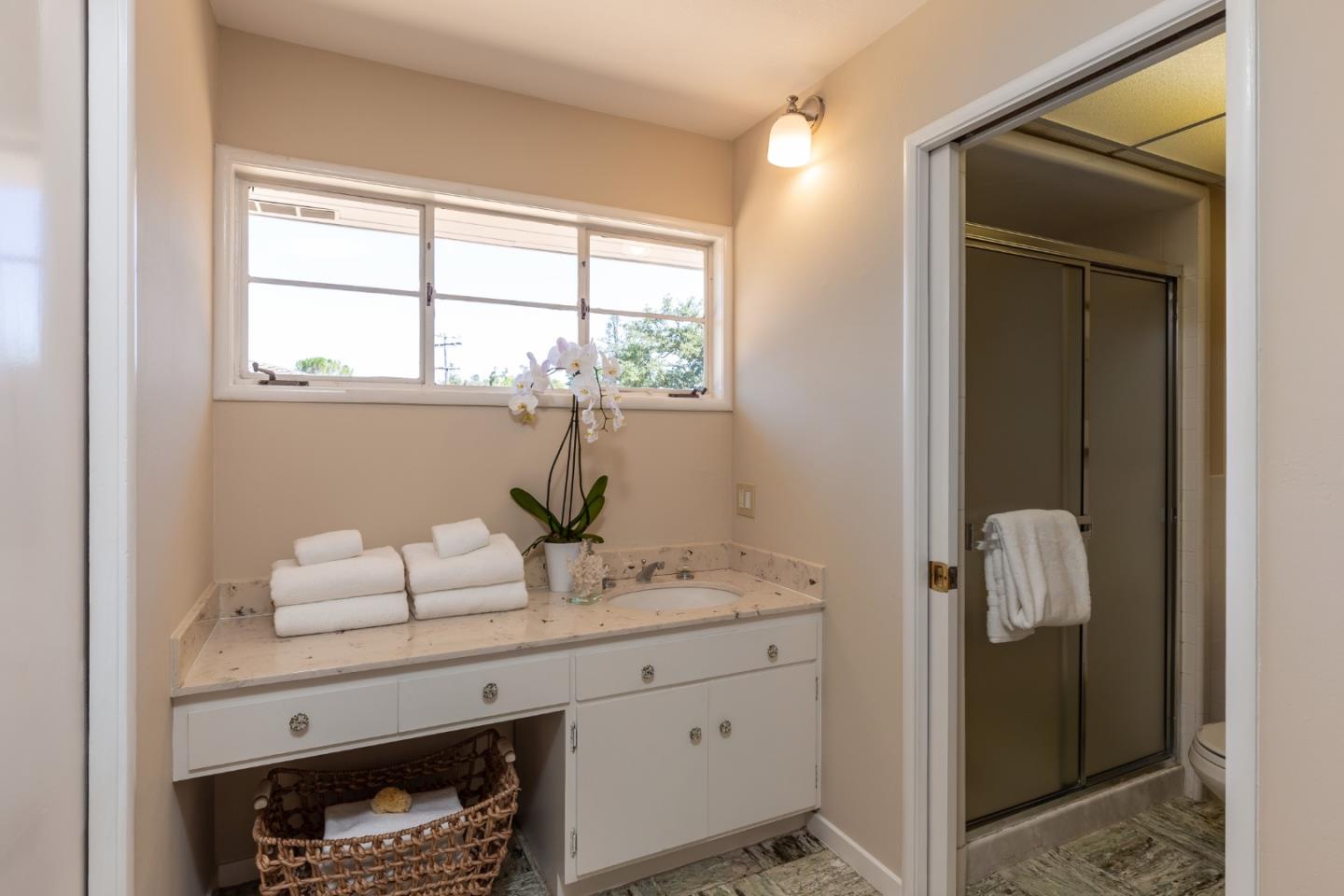 330 Corte Madera Road Portola Valley, CA 94028 - Photo 12 of 24 a bathroom with a sink and a window