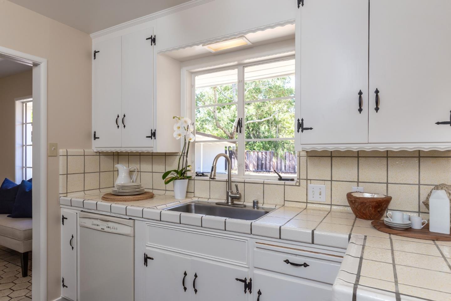330 Corte Madera Road Portola Valley, CA 94028 - Photo 7 of 24 a kitchen with a white cabinets and window