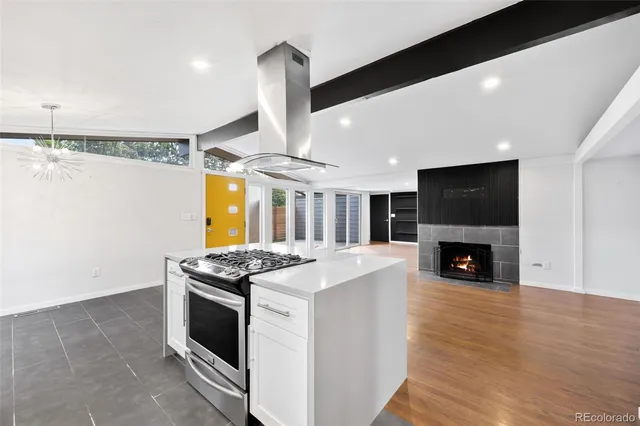 a kitchen with stainless steel appliances granite countertop a stove and a refrigerator