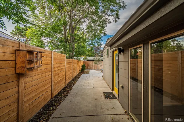 a side view of a house with garden
