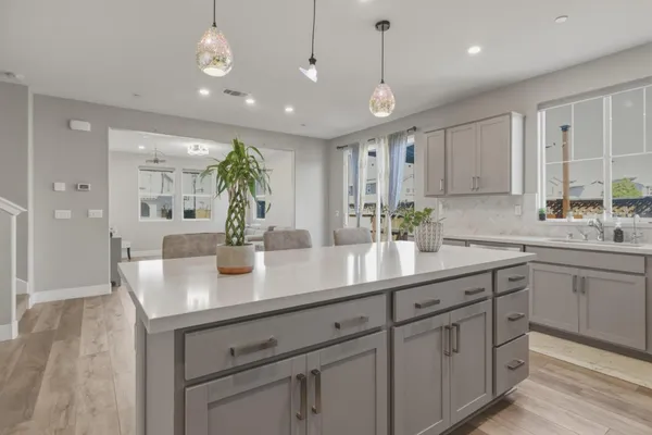 a view of a livingroom with furniture and an empty room