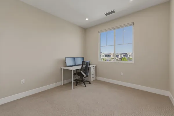 a view of a workspace with furniture