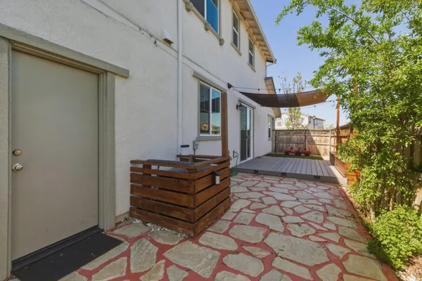 a view of balcony with floor to ceiling windows with wooden floor