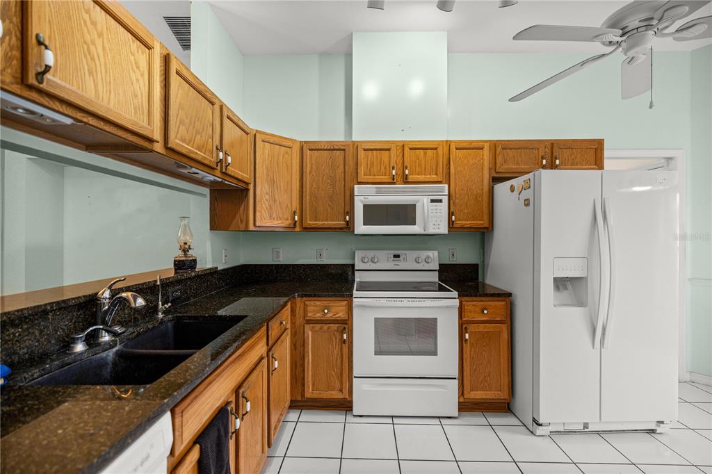 10891 Southwest 69th Circle Ocala, FL 34476 - Photo 11 of 28 a kitchen with a sink cabinets and appliances