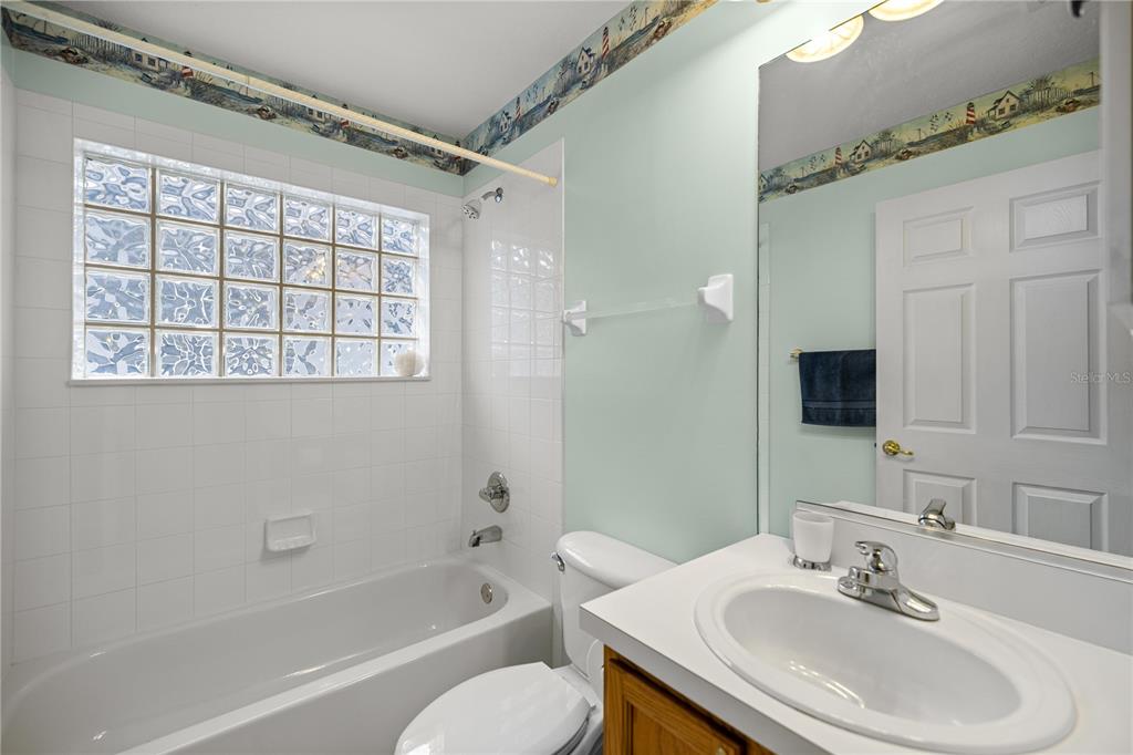 10891 Southwest 69th Circle Ocala, FL 34476 - Photo 21 of 28 a bathroom with a sink toilet and shower