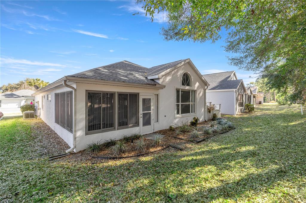 10891 Southwest 69th Circle Ocala, FL 34476 - Photo 28 of 28 a view of a house with a yard