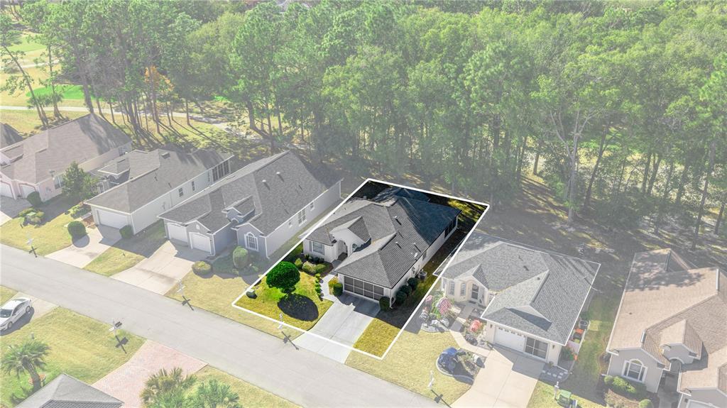 10891 Southwest 69th Circle Ocala, FL 34476 - Photo 4 of 28 an aerial view of a house with a yard