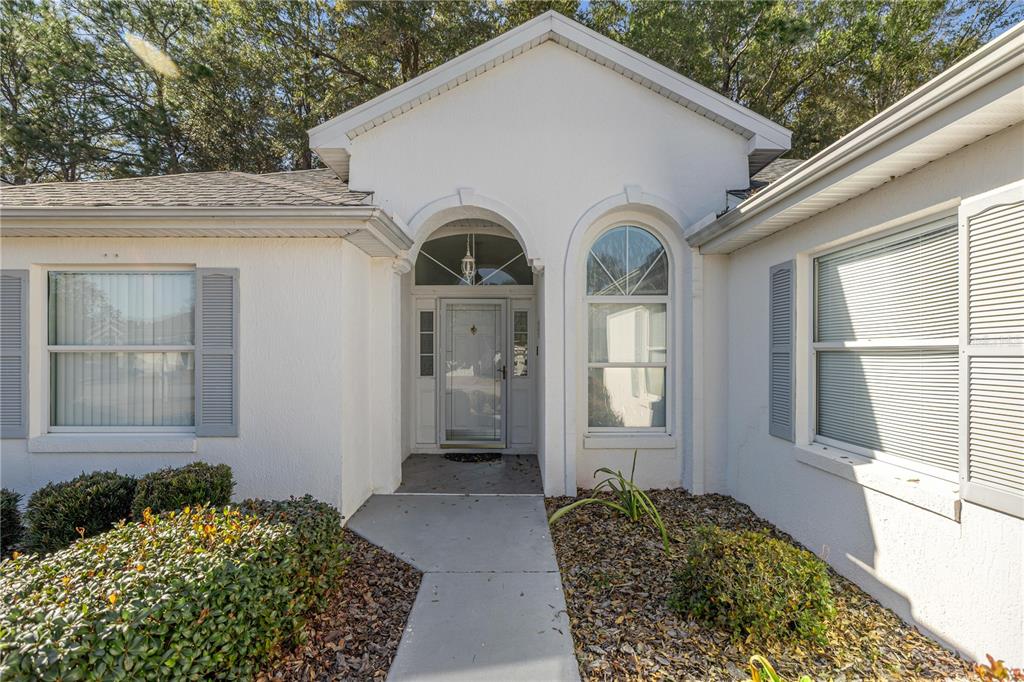 10891 Southwest 69th Circle Ocala, FL 34476 - Photo 5 of 28 a front view of a house